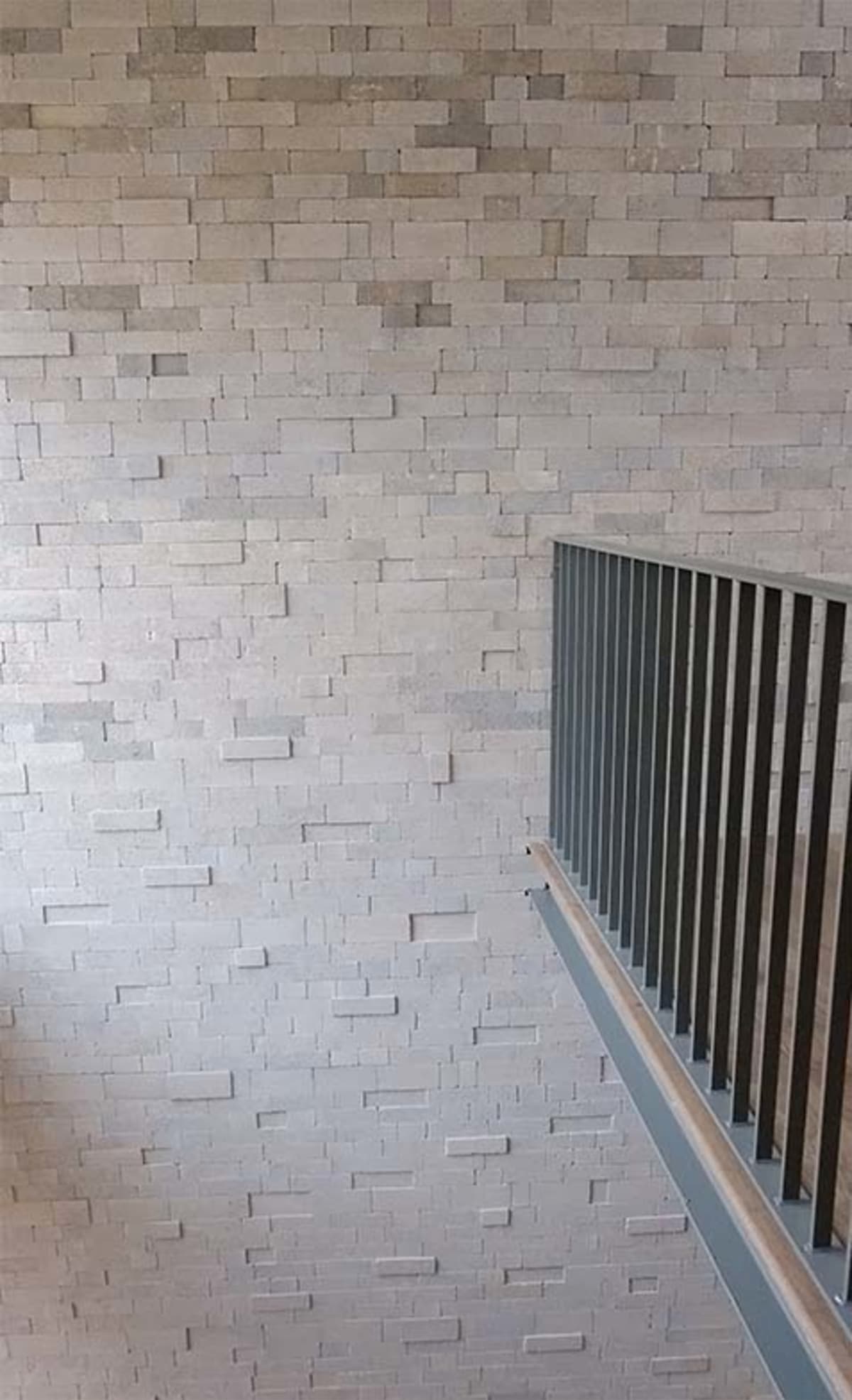 Internal brick wall with overlooking balcony