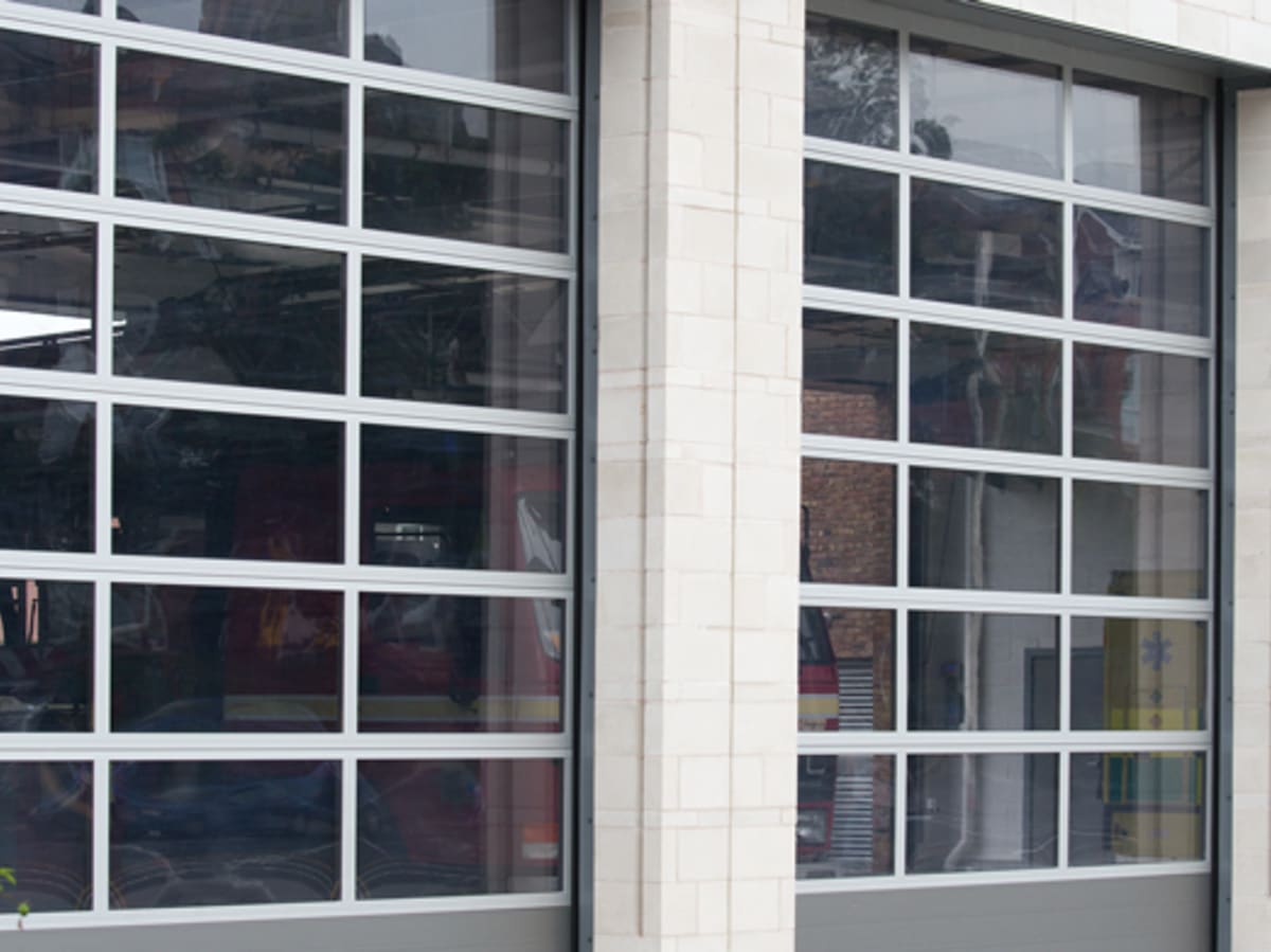 Fire station doors surrounded by cast stone masonry