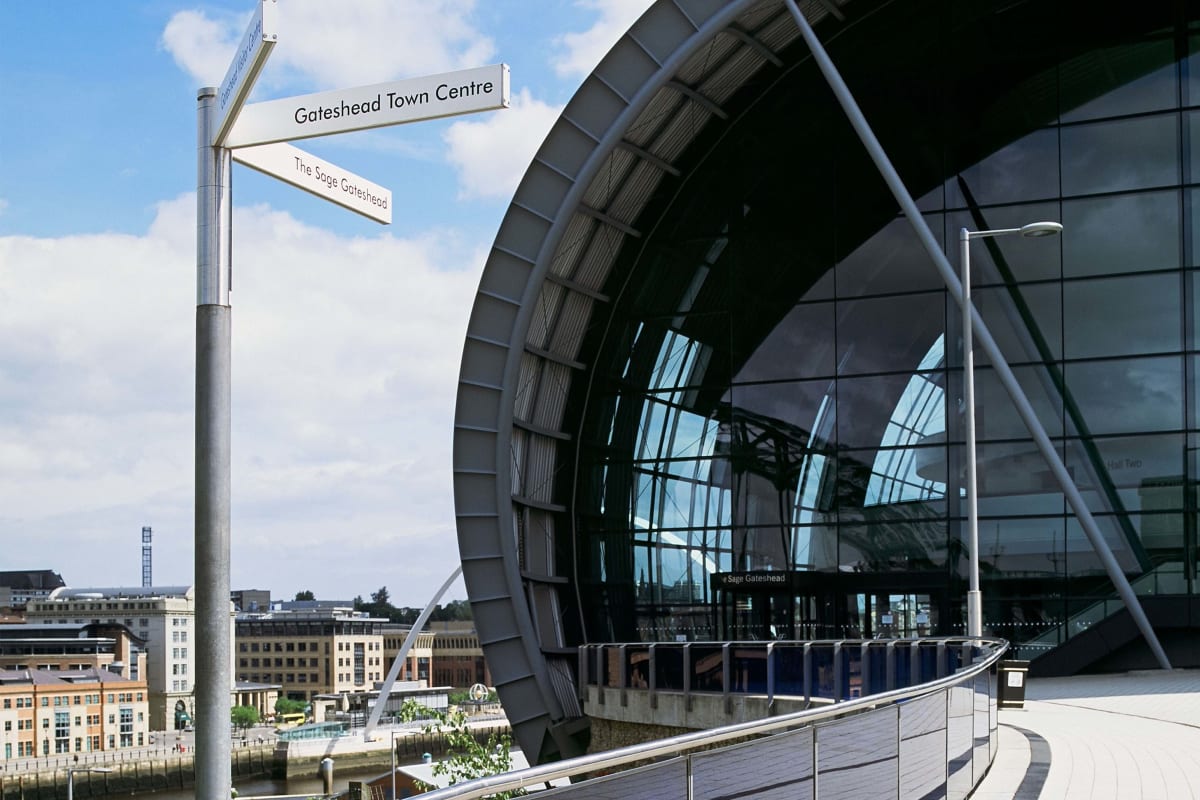 bespoke post and rail system with glass panels and geo fingerpost
