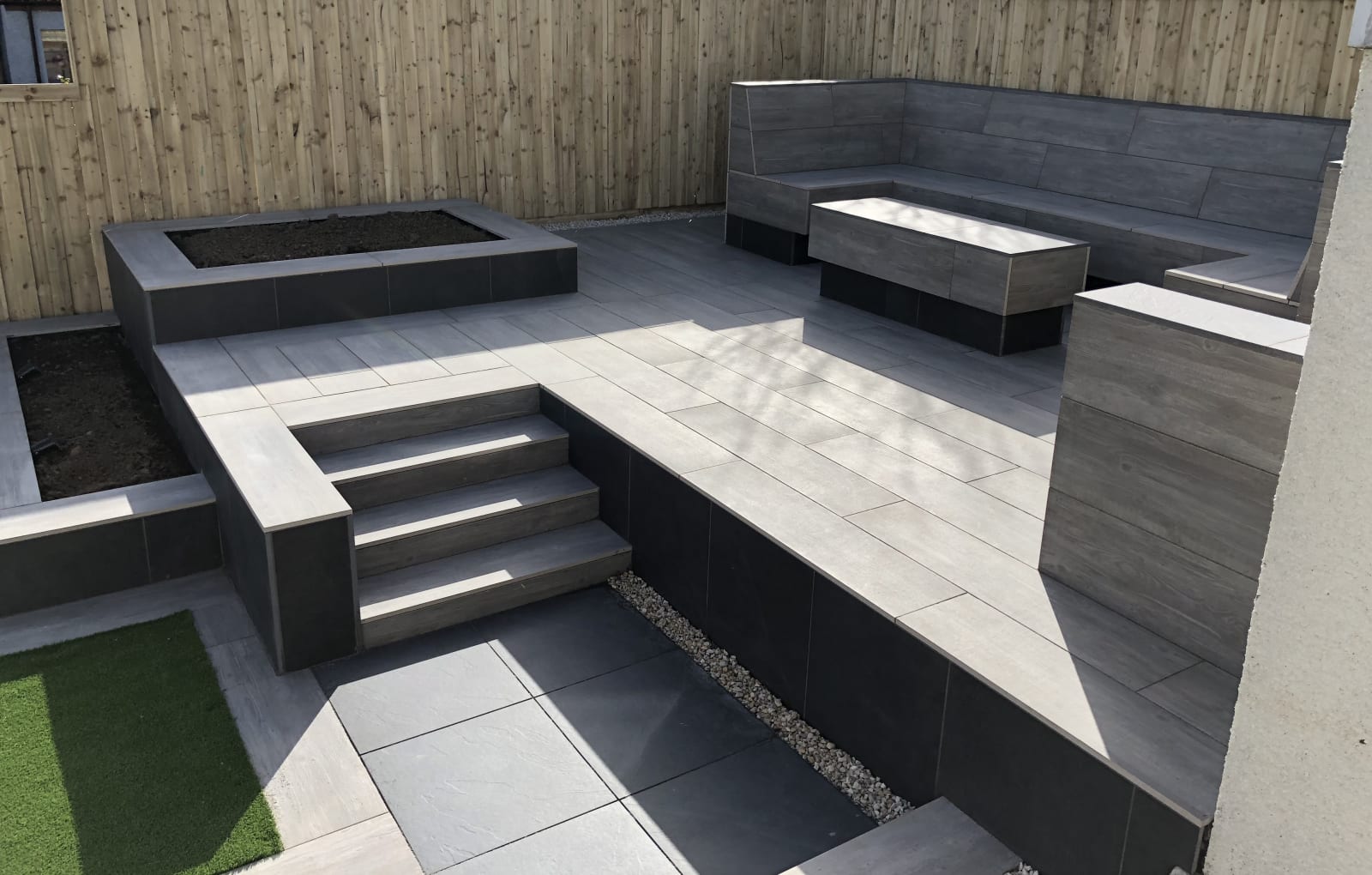 Symphony porcelain paving with bespoke seating area