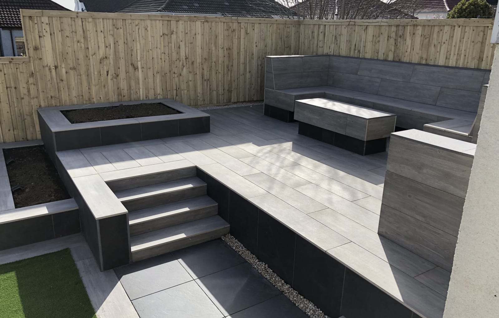 Symphony porcelain paving with bespoke seating area