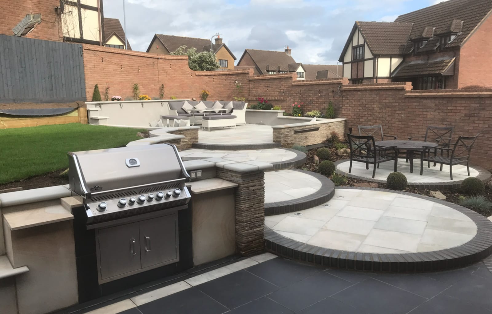 Multi-level patio with outdoor kitchen
