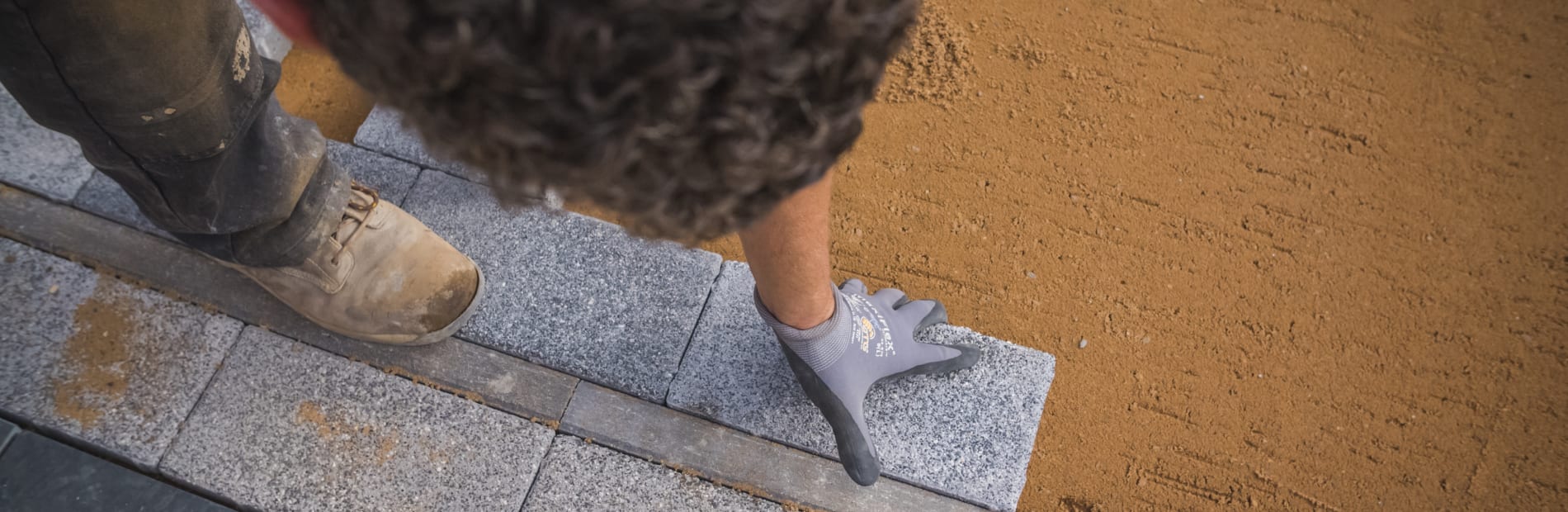 Installer laying paving
