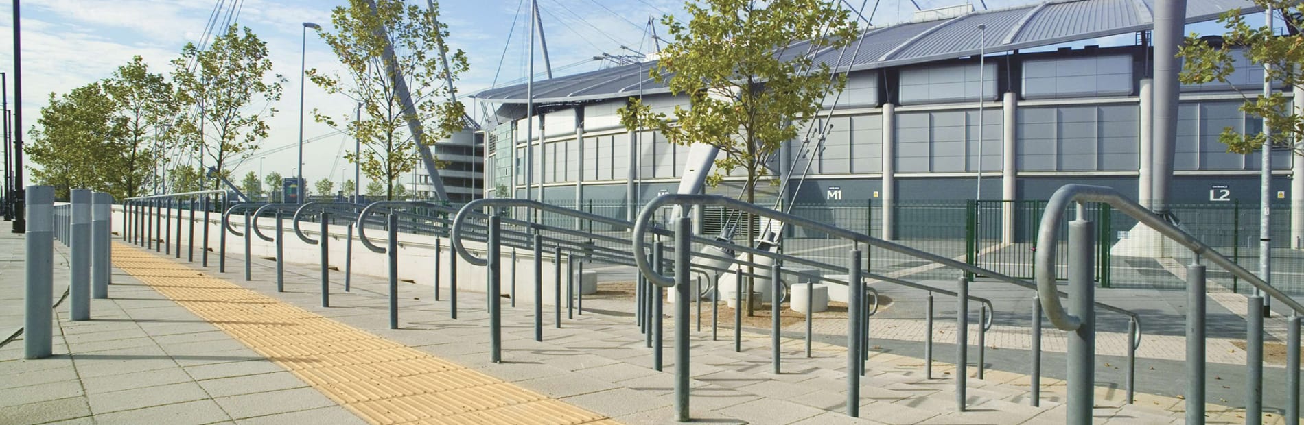 tactile paving at the top of some outdoor stairs