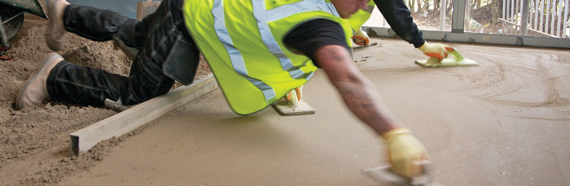 Builder laying screed