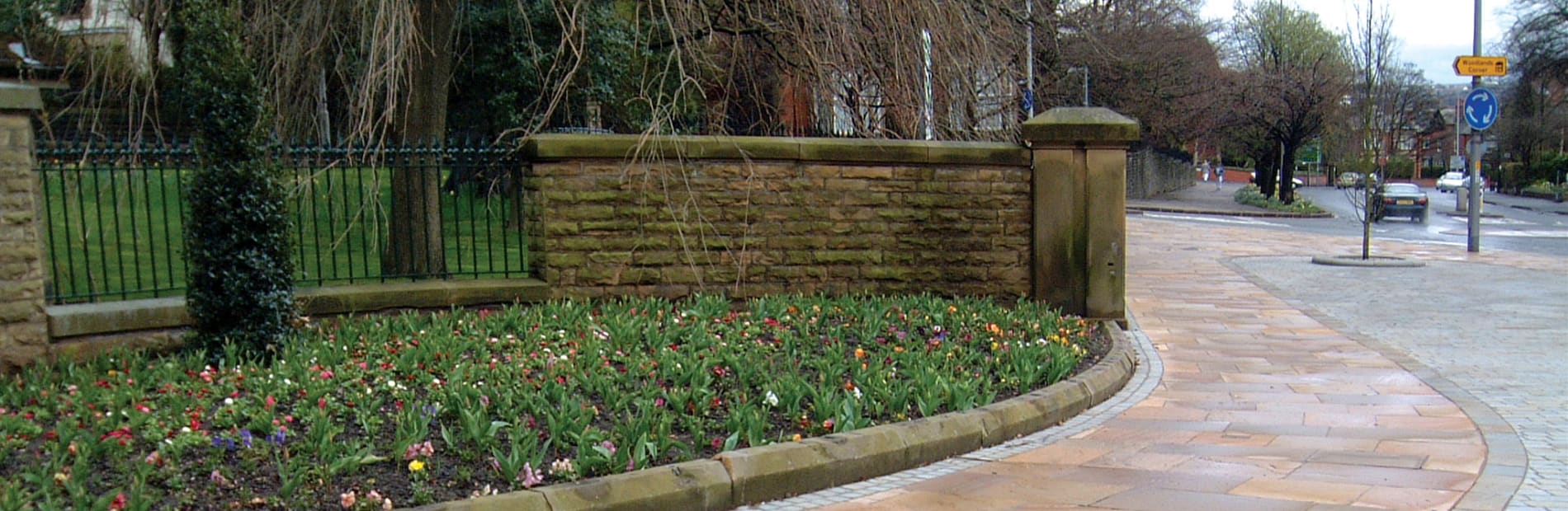 Porphyry paving outside of a park.