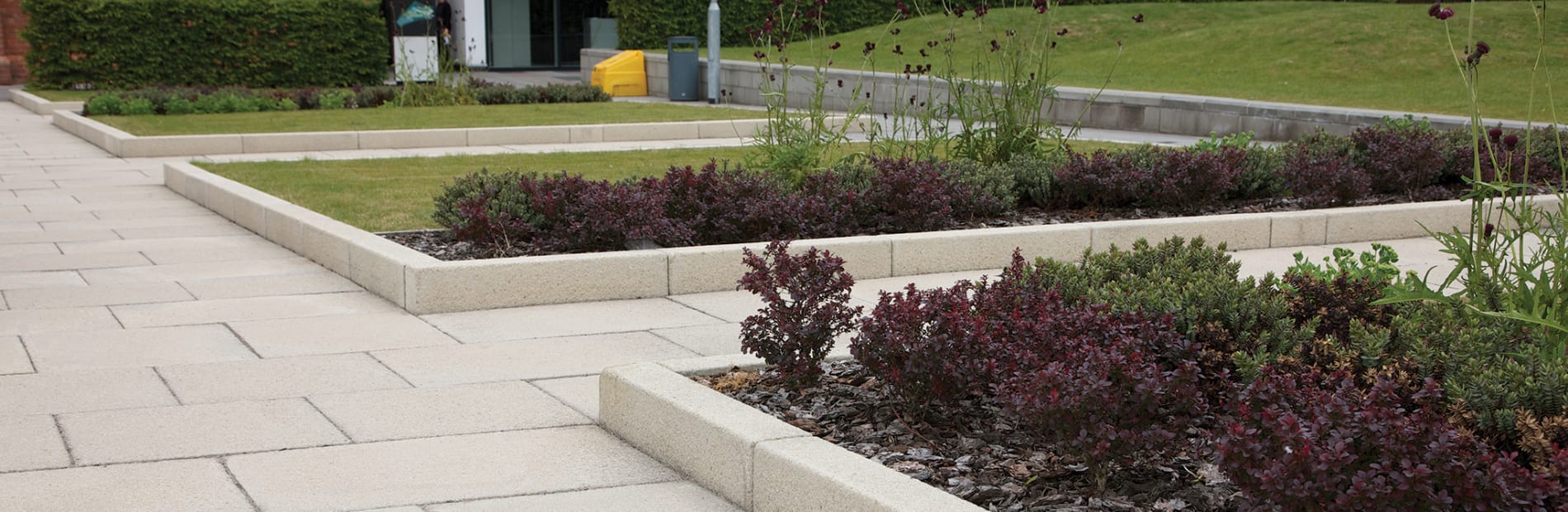 saxon textured kerb laid in a car park of a commercial building