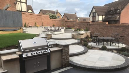 Multi-level patio with outdoor kitchen