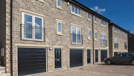 Dark grey and buff walling used on new housing.