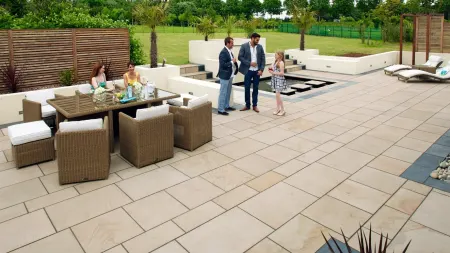Family talking in a garden patio area