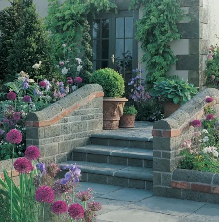 Garden planters placed at the top of a set of garden steps