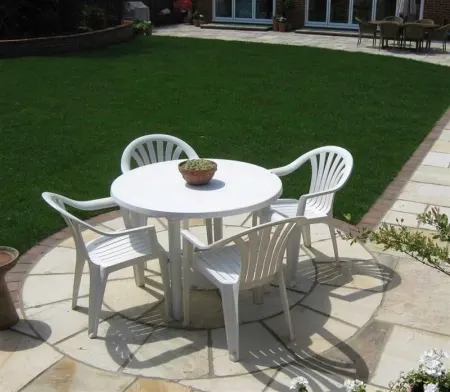 Plastic garden furniture in a patio area