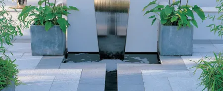 Water feature displayed in garden patio area.