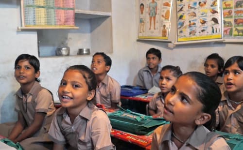 group of children learning in school