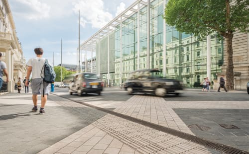 linear drainage system outside busy city street