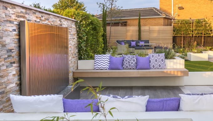 Mediterranean garden with StoneFace Drystack in Harvest
