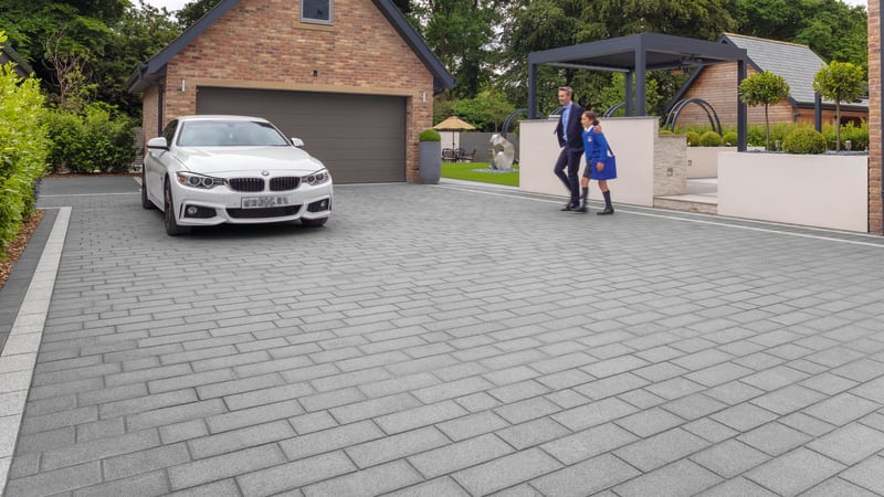 Grey granite driveway outside modern home
