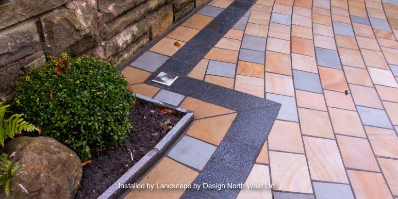 Marshalls Driveway Setts in autumn bronze and silver birch with Sawn Granite Setts in graphite edging  installed by a Marshalls register member.
