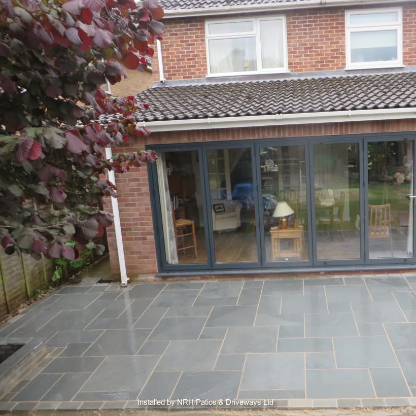 Marshalls grey paving laid in front of a modern home.