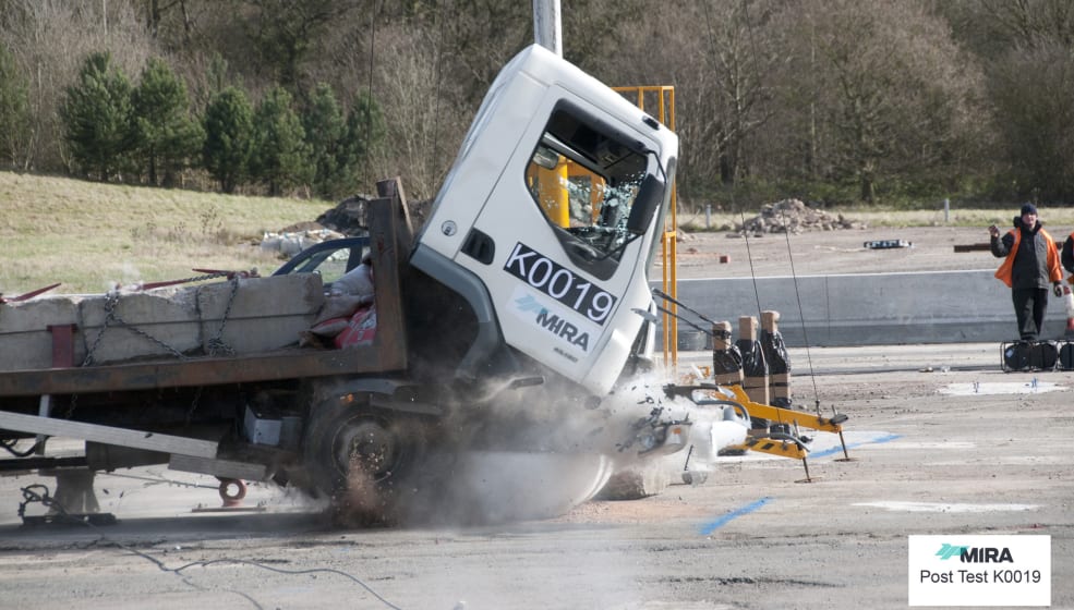 Wagon crashing into landscape protection.