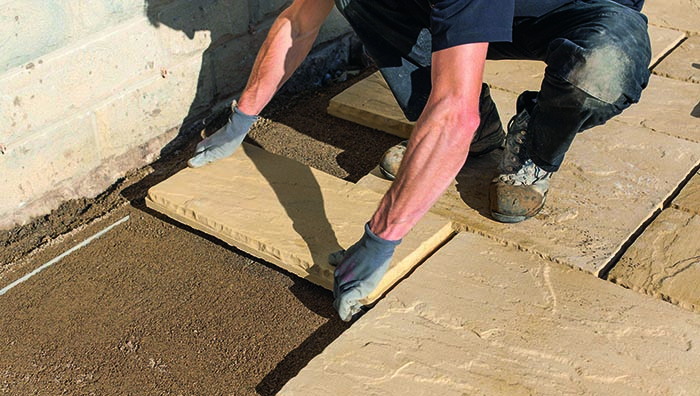 laying concrete paving slabs on sand