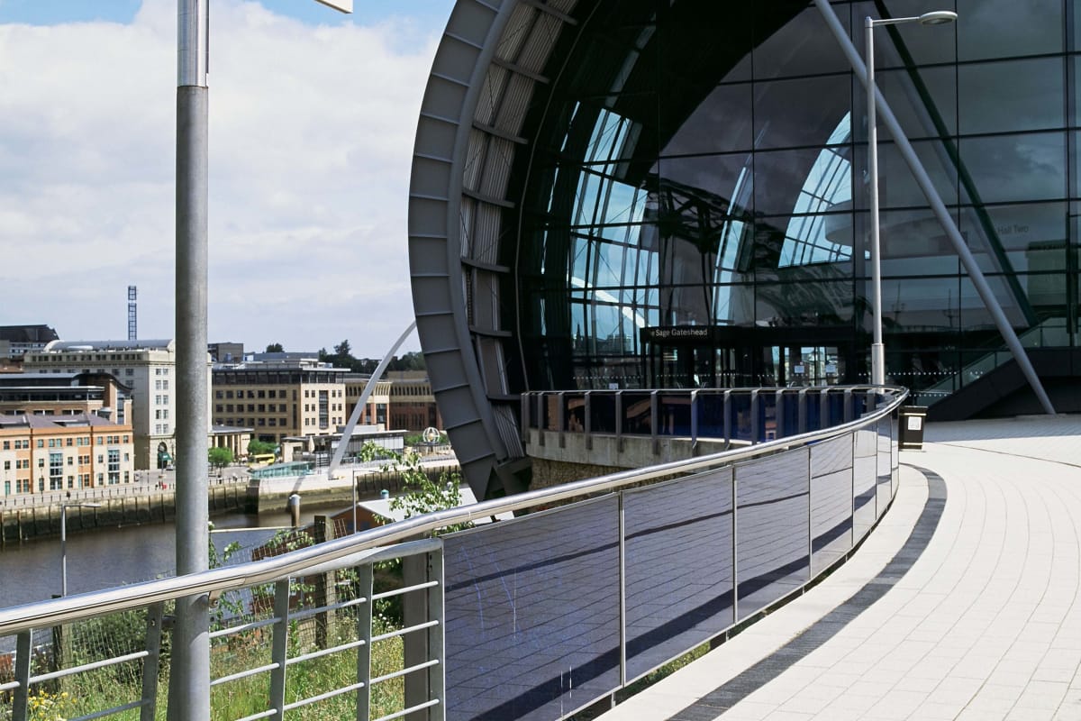 bespoke post and rail system with glass panels and geo fingerpost
