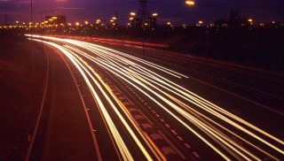 A timelapse of a busy motorway at night.