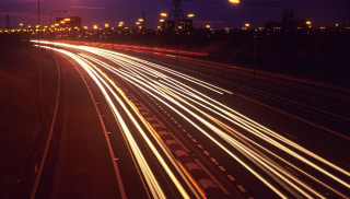 A timelapse of a busy motorway at night.