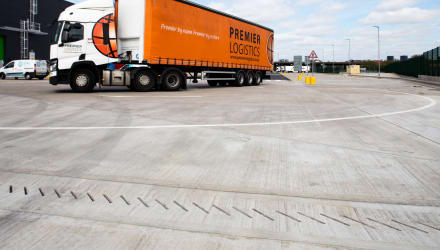 Industrial loading and unloading with linear drainage present