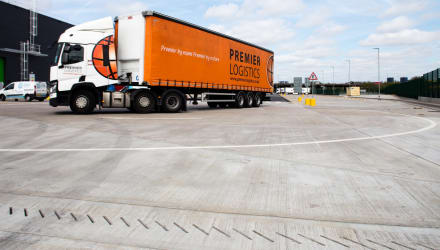 Industrial loading and unloading with linear drainage present