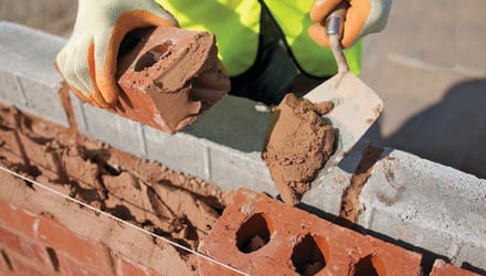 Mortar being used on bricks