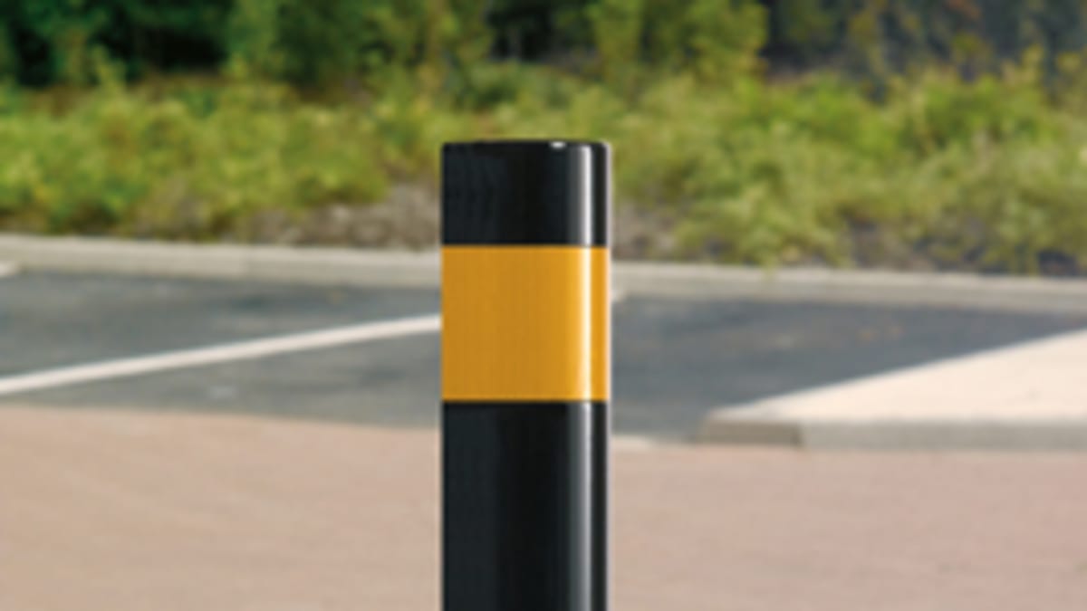 black bollard with yellow reflective strip