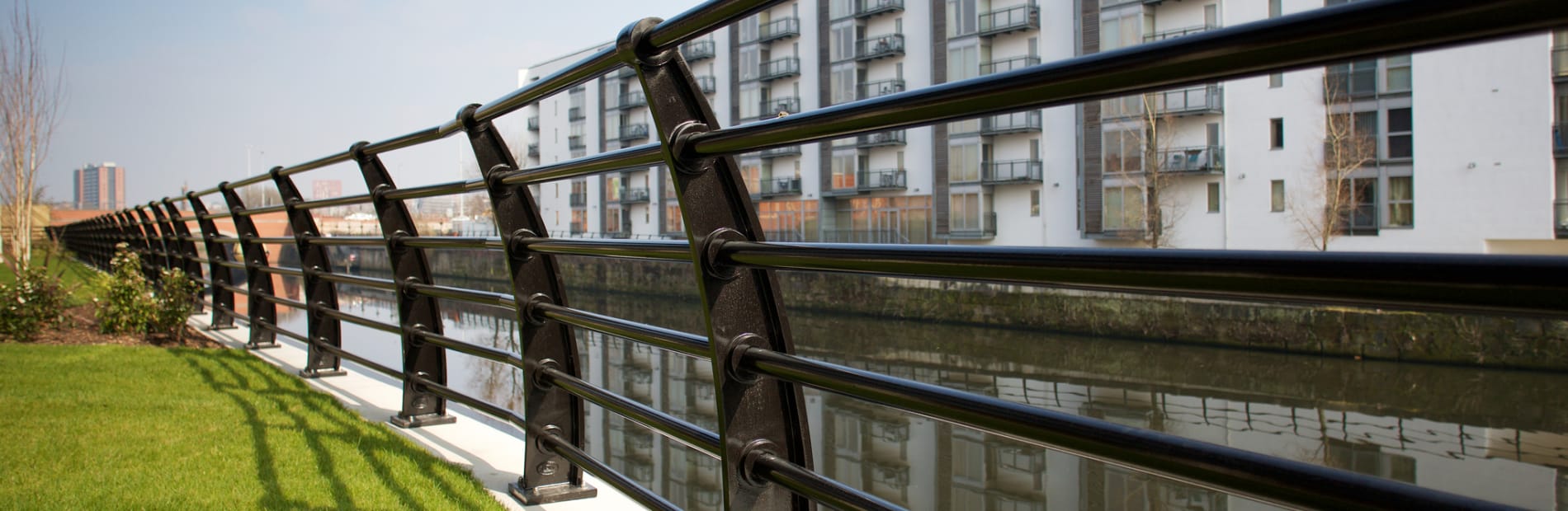 Black railings outside apartment block.