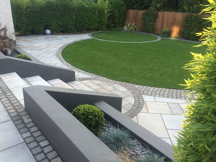 Grey paving used in a garden patio area