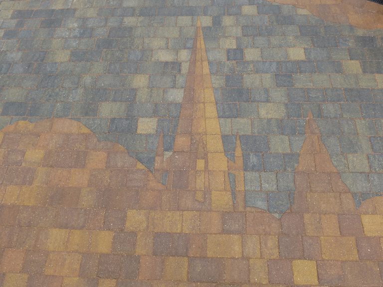 Spire tower engraved on paving.