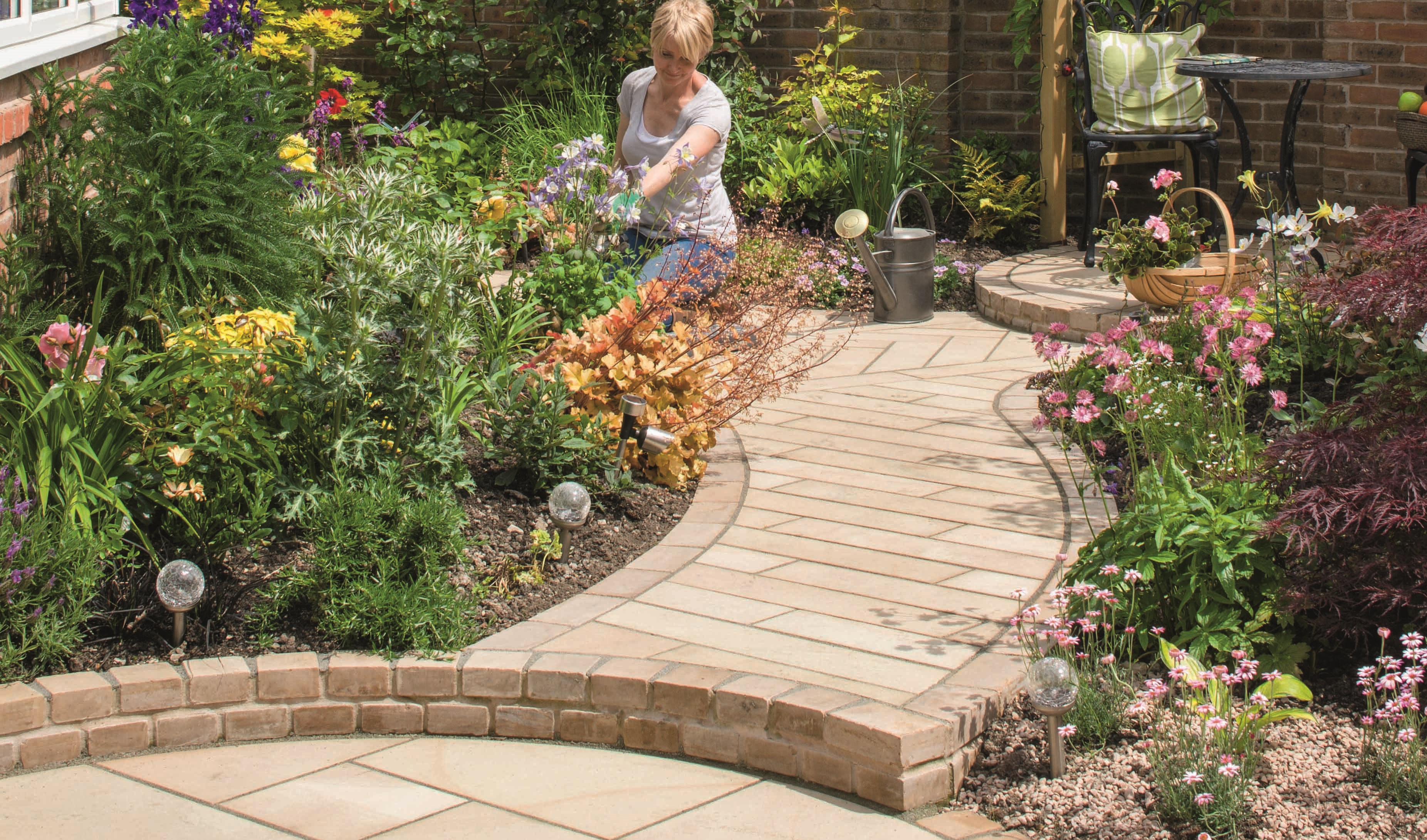 [A winding garden path with Sawn Versuro paving