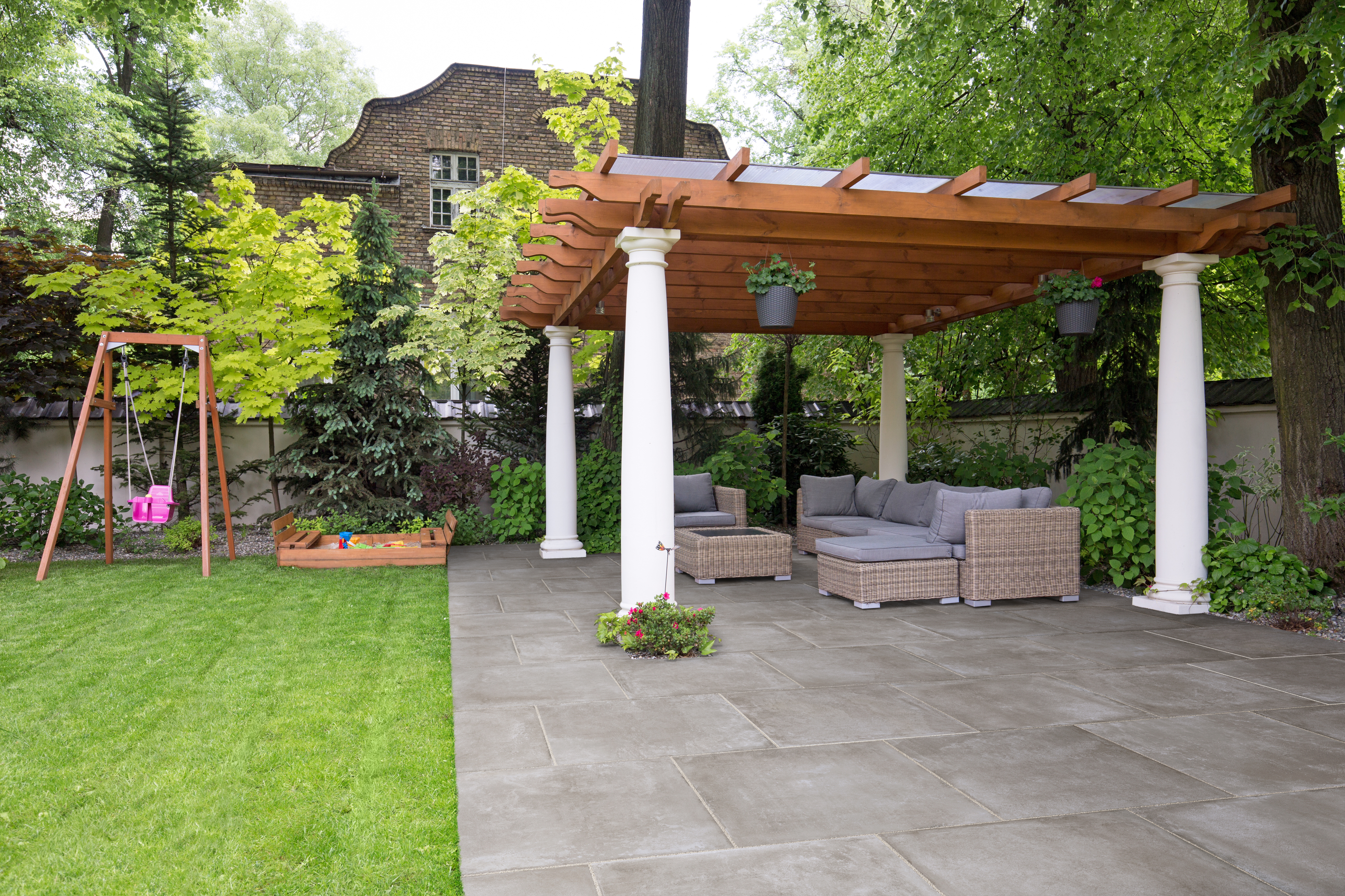 A large awning over garden furniture
