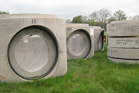 Water management solutions including sealed manholes for house builders