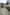 White lorry parked next to a grey high kerb.