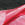 Red tanking membrane laid on gravel.